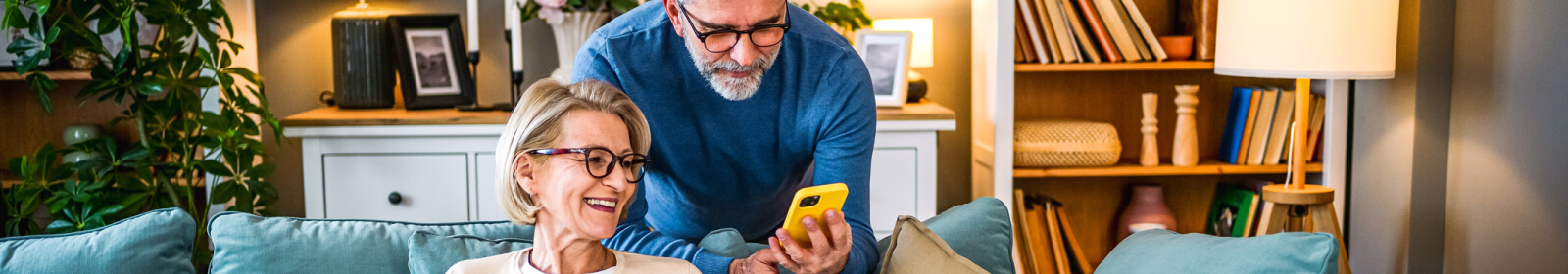mature couple looking at a smartphone